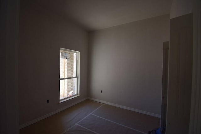 empty room featuring baseboards