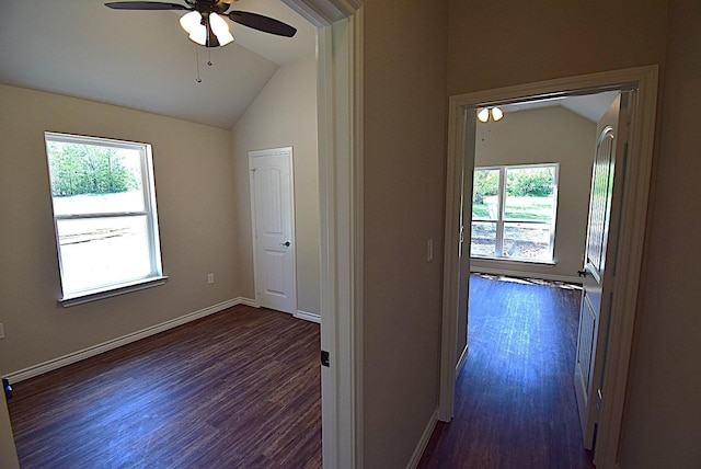110 Saint Francis Ln, Mabank, TX 75156 - hallway featuring vaulted ceiling, healthy amount of natural light, dark wood finished floors, and baseboards