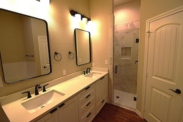110 Saint Francis Ln, Mabank, TX 75156 - full bath featuring a shower stall, wood finished floors, and double vanity