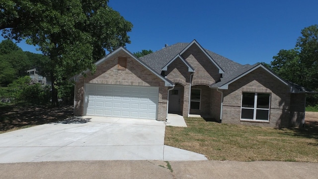 110 Saint Francis Ln, Mabank, TX 75156 - french provincial home with driveway, a garage, a front lawn, brick siding, and roof with shingles