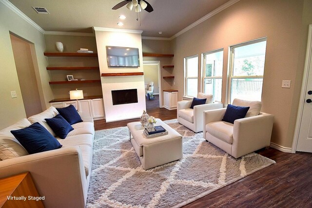 110 Saint Francis Ln, Mabank, TX 75156 - living room with a ceiling fan, ornamental molding, wood finished floors, a fireplace, and baseboards