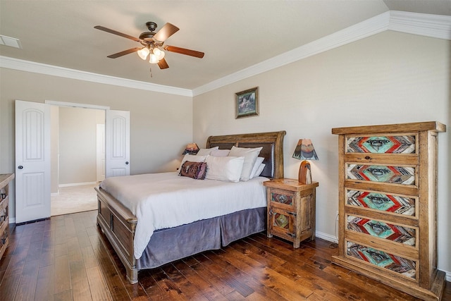 bedroom with a ceiling fan, baseboards, dark wood-style floors, visible vents, and ornamental molding