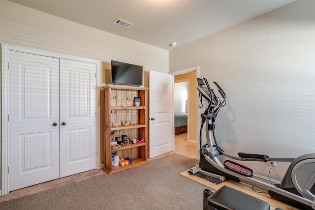 workout area featuring carpet and visible vents