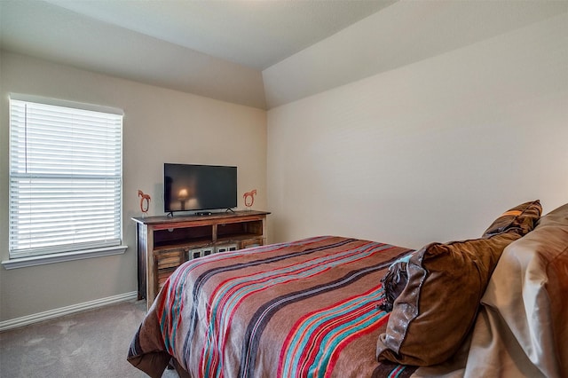 bedroom with baseboards and carpet