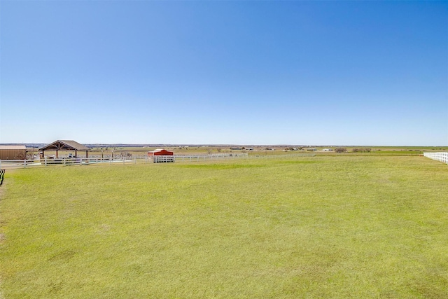 view of yard with a rural view