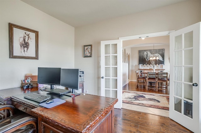 office featuring french doors, dark wood finished floors, and a chandelier