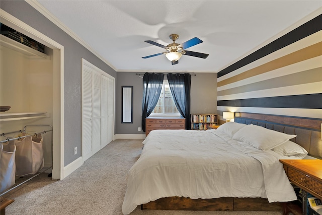 bedroom featuring ceiling fan, baseboards, crown molding, and carpet