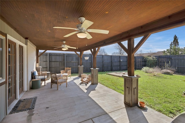 view of patio featuring a fenced backyard and a ceiling fan