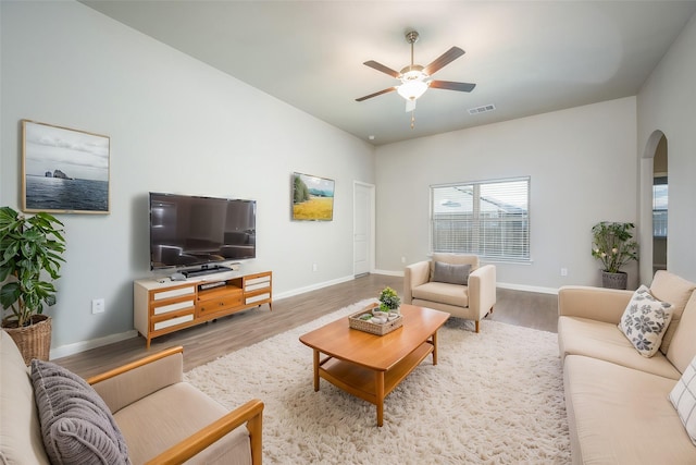 900 Juneberry Dr, Denton, TX 76207 - living room featuring arched walkways, visible vents, a ceiling fan, and wood finished floors