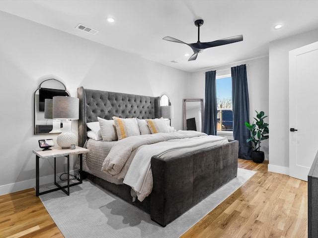 bedroom with light wood finished floors, visible vents, recessed lighting, and baseboards