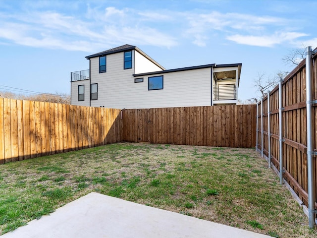 view of yard with a patio area and a fenced backyard