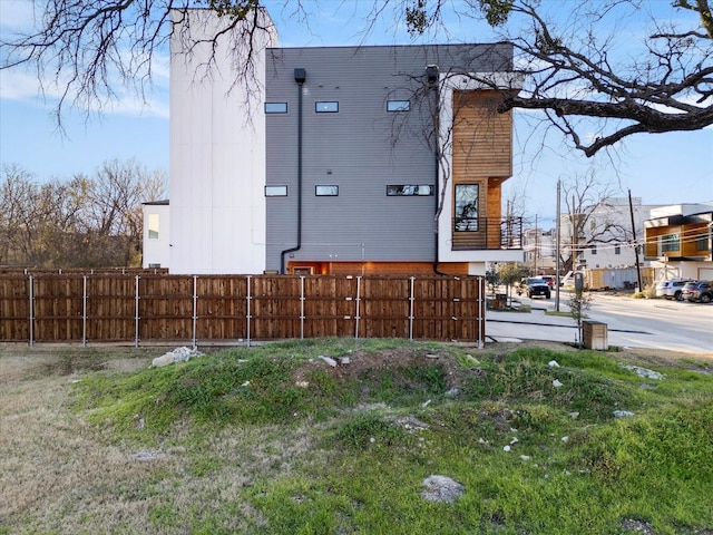 view of side of property with fence