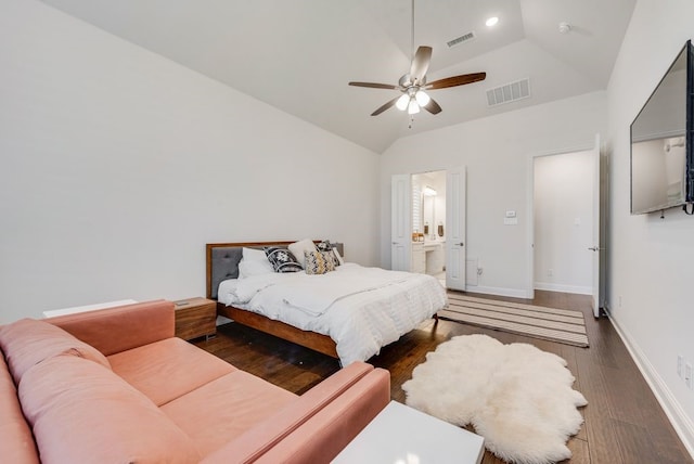 bedroom featuring visible vents, baseboards, wood finished floors, and vaulted ceiling