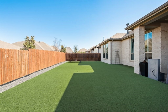 view of yard featuring a fenced backyard