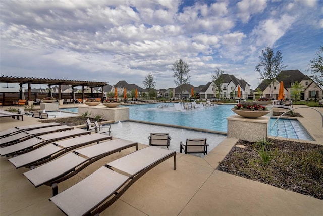 community pool with fence, a patio area, and a pergola