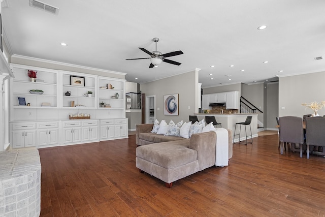 living area with ceiling fan, visible vents, wood finished floors, and recessed lighting