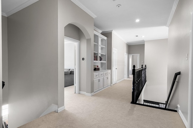 hall featuring baseboards, recessed lighting, ornamental molding, an upstairs landing, and light colored carpet