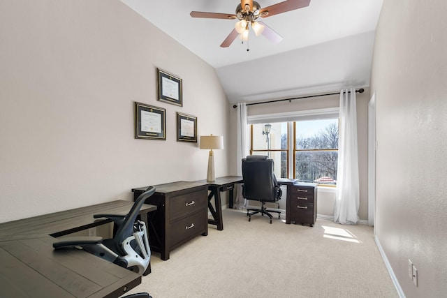 home office with light colored carpet, a ceiling fan, baseboards, and vaulted ceiling