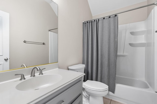 full bathroom with shower / bath combo with shower curtain, toilet, vanity, and tile patterned flooring