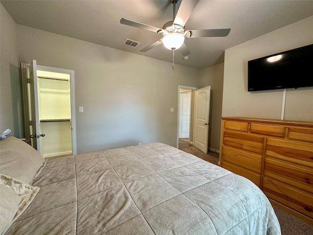 carpeted bedroom featuring visible vents and ceiling fan