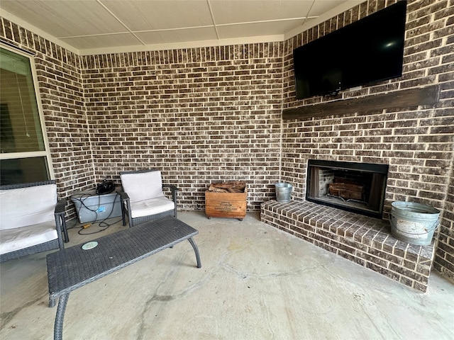 view of patio / terrace with a brick fireplace