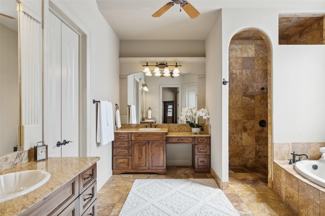 full bath featuring a tile shower, two vanities, a garden tub, and a sink