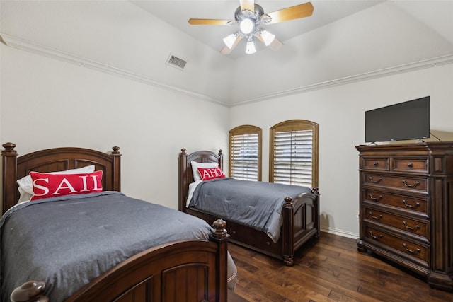 bedroom featuring dark wood finished floors, lofted ceiling, a ceiling fan, and visible vents