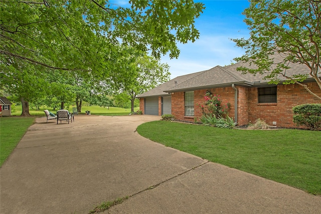 view of front facade featuring a garage, brick siding, and a front lawn