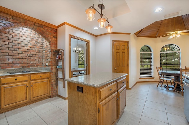 kitchen featuring light tile patterned floors, brick wall, black electric stovetop, and ornamental molding