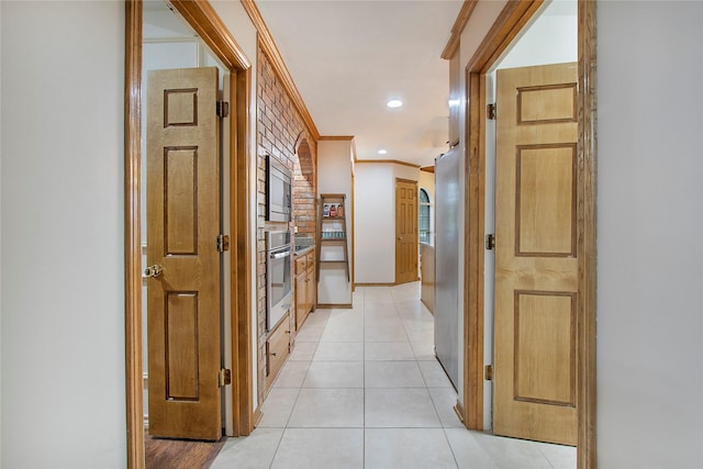 corridor with crown molding, baseboards, mail area, light tile patterned floors, and recessed lighting