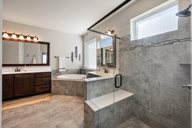 bathroom featuring vanity, a garden tub, and a stall shower