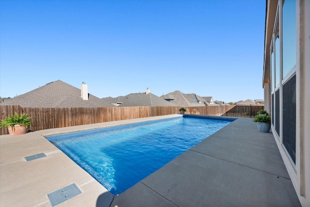 view of pool with a fenced in pool, a patio, and a fenced backyard