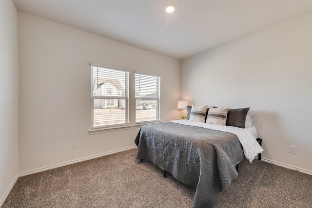 bedroom with baseboards and carpet floors