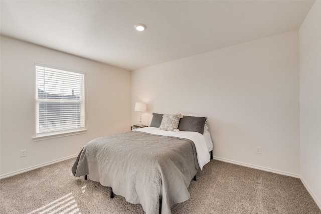 bedroom with carpet and baseboards