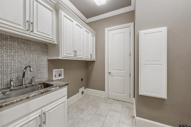 washroom with ornamental molding, hookup for a washing machine, cabinet space, hookup for an electric dryer, and a sink