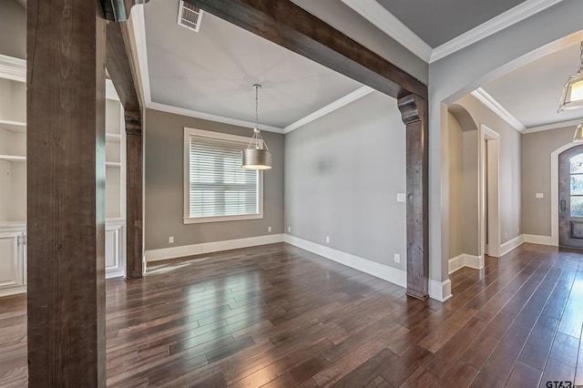 unfurnished dining area with visible vents, arched walkways, plenty of natural light, and dark wood-style flooring