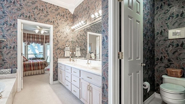 ensuite bathroom featuring toilet, ornamental molding, ensuite bathroom, wallpapered walls, and double vanity