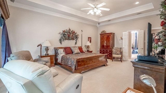 bedroom featuring visible vents, light carpet, a raised ceiling, and ornamental molding