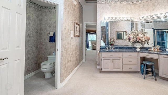 bathroom featuring wallpapered walls, toilet, vanity, and baseboards