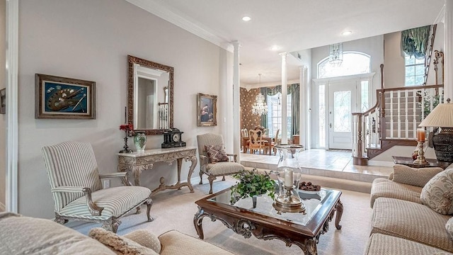 living area with stairs, an inviting chandelier, recessed lighting, and baseboards