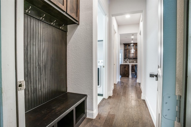814 Davids Way, Allen, TX 75013 - mudroom with a sink, baseboards, dark wood-style flooring, and a textured wall