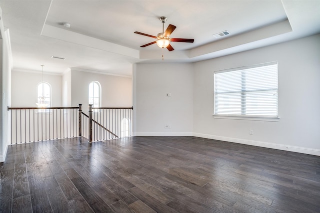814 Davids Way, Allen, TX 75013 - spare room with dark wood-style floors, visible vents, a raised ceiling, and baseboards