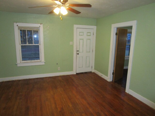 711 N 10th St, Memphis, TX 79245 - unfurnished room with ceiling fan, baseboards, and wood finished floors