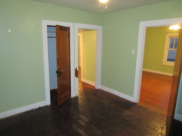 711 N 10th St, Memphis, TX 79245 - unfurnished bedroom with baseboards and wood finished floors