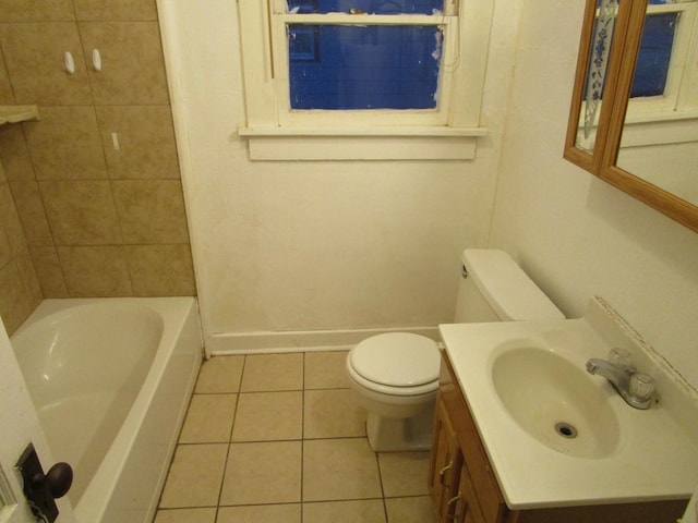 711 N 10th St, Memphis, TX 79245 - full bathroom with tile patterned floors, toilet, vanity, and baseboards