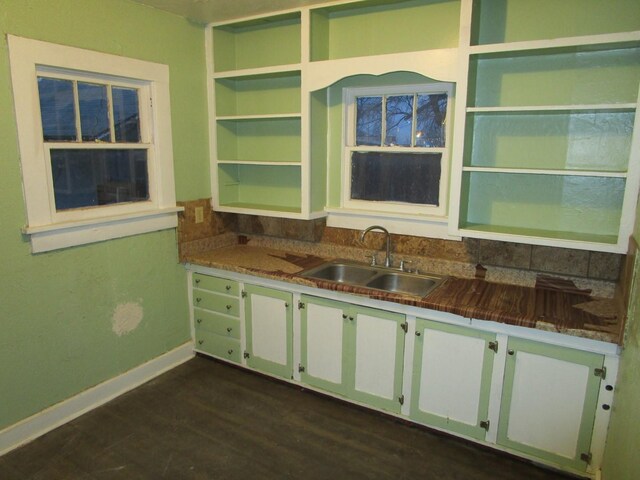 711 N 10th St, Memphis, TX 79245 - kitchen with baseboards, dark wood finished floors, open shelves, a sink, and white cabinetry