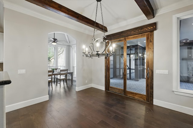 unfurnished dining area featuring ceiling fan, baseboards, beamed ceiling, hardwood / wood-style floors, and arched walkways