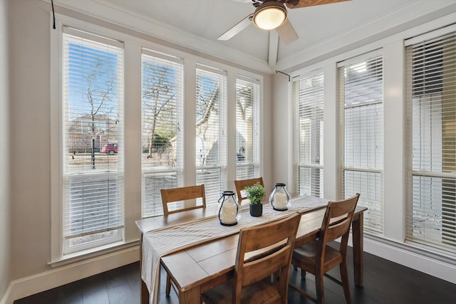 dining room with crown molding, dark wood-type flooring, and ceiling fan