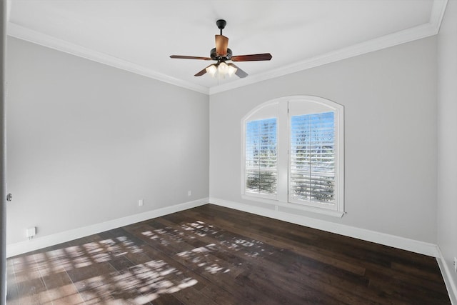 empty room with ceiling fan, baseboards, wood finished floors, and crown molding