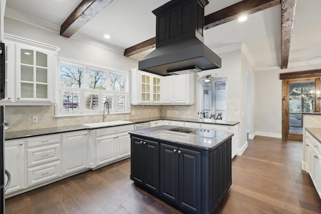 kitchen featuring a sink, beamed ceiling, black electric stovetop, and exhaust hood